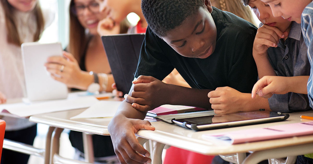 Students using android tablets in a classroom