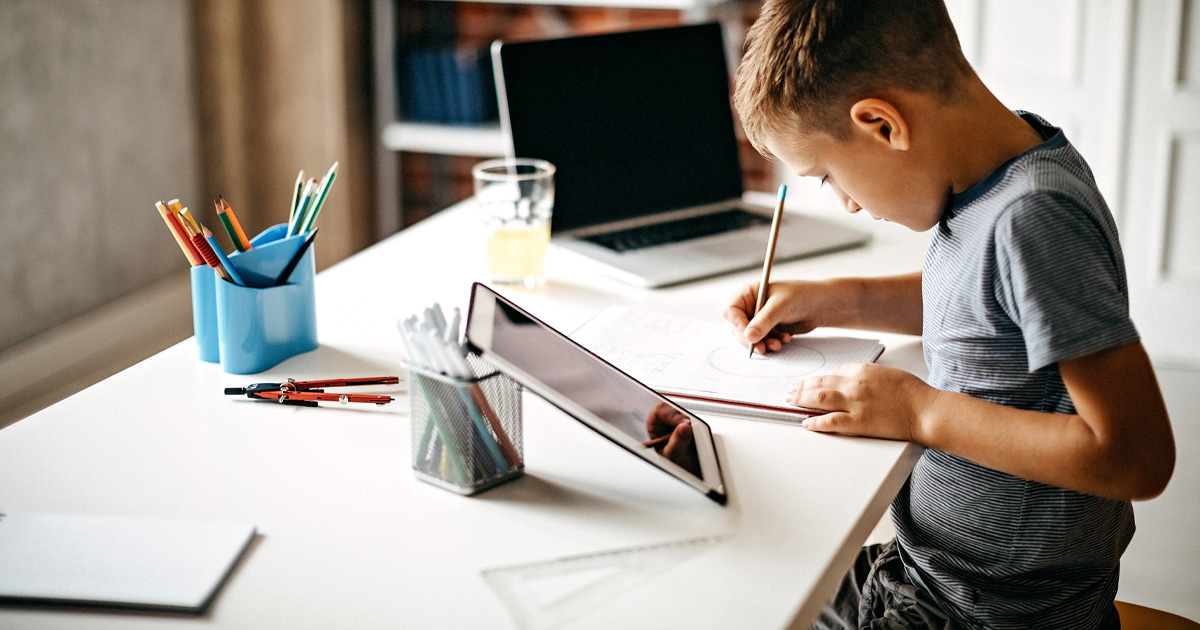 child using tablet for homework