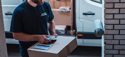 delivery person using phone for logistics management