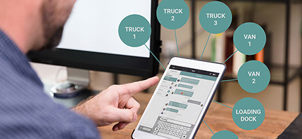 man using tablet tracking app for fleet location management