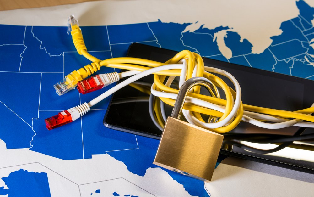 Knotted net cable around a padlock over a US map