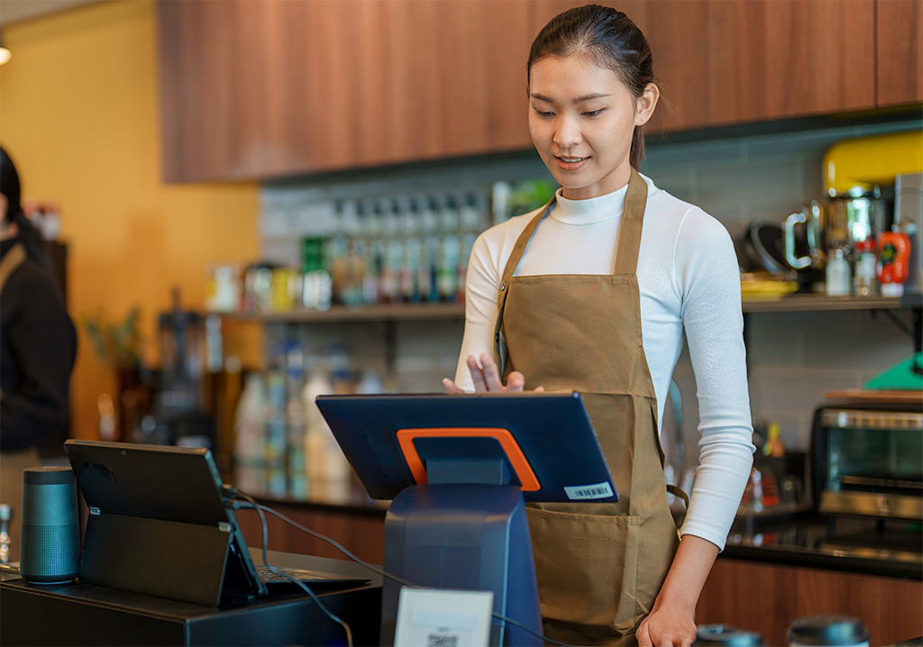 Lady Using Pos System For Retail