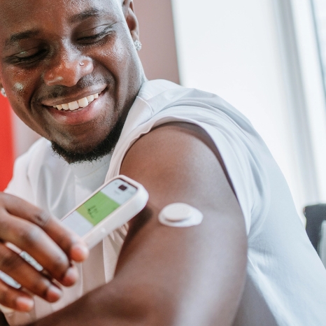 Man Using Phone To Control Medical Device