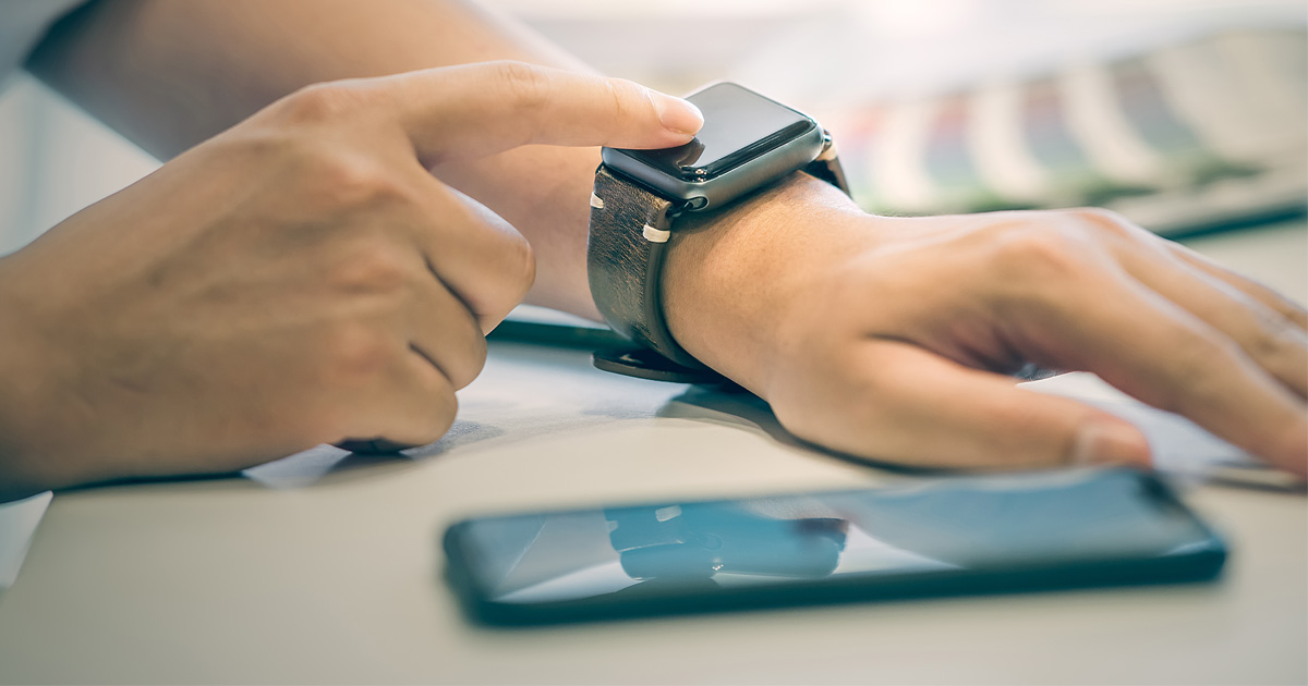 patient using smartphone as remote patient monitoring technology