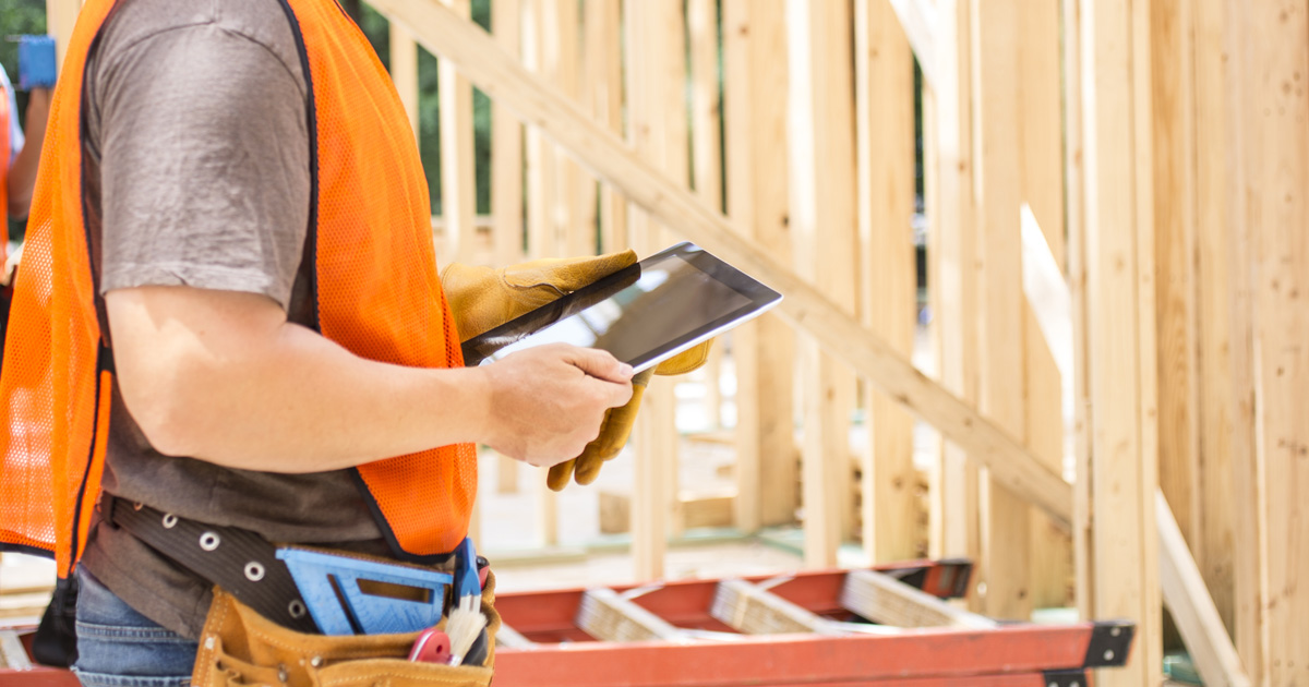 Construction worker using android tablet